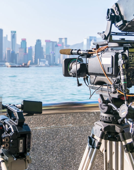 Video equipment in front of city skyline