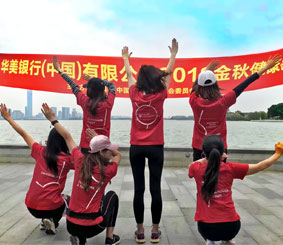 A group of EWB China associates posing by the water