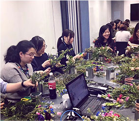 People making flower arrangements