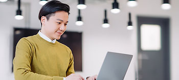 Man at a desk using a laptop